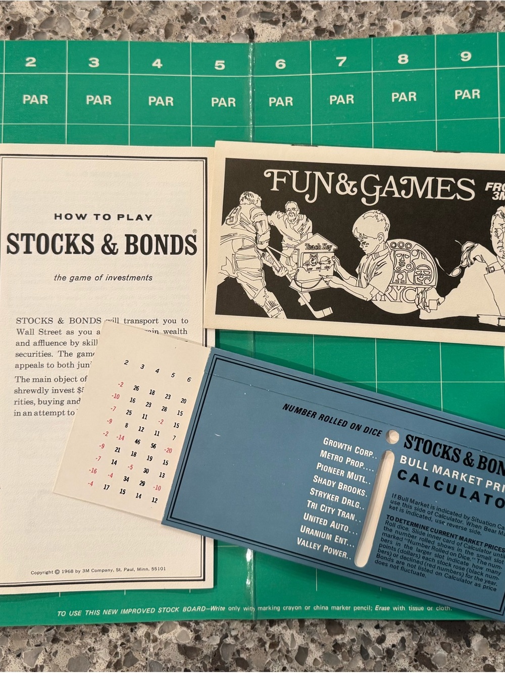 Stocks & Bonds Board Game Components - Green Game Board with Blue Card